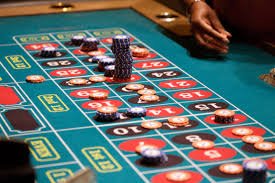 NetEnt baccarat table with cards and betting layout